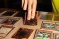 A man playing Yu-Gi-Oh trading card game.