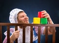 Man in playpen playing Royalty Free Stock Photo