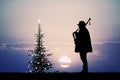 Man plays the bagpipes at Christmas