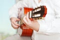 Man plays on classical acoustic guitar Royalty Free Stock Photo