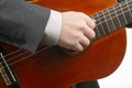 Man plays the classical guitar on a white background. musical creativity. string musical instrument