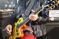 Man plays electric guitar in studio Royalty Free Stock Photo