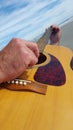 Man plays guitar at the beach Royalty Free Stock Photo