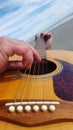 Man plays guitar at the beach Royalty Free Stock Photo