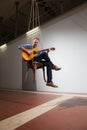 Man plays a guitar, interior