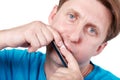 Man plays mouth harmonica Royalty Free Stock Photo