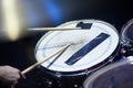 Man plays musical percussion instrument with sticks closeup on a black background, a musical concept with the working Royalty Free Stock Photo