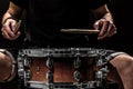 man plays musical percussion instrument with sticks a musical concept with the working drum Royalty Free Stock Photo