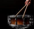 man plays musical percussion instrument with sticks a musical concept with the working drum Royalty Free Stock Photo