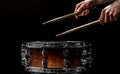 man plays musical percussion instrument with sticks a musical concept with the working drum Royalty Free Stock Photo