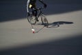 Man playing urban bike polo. Cyclist hitting the ball with a bundy, close up Royalty Free Stock Photo