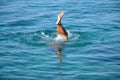 Man plunging in sea water