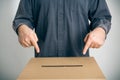 Man Pointing At Ballot Box