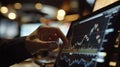 A man is pointing at a computer screen with a graph on it Royalty Free Stock Photo