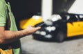 Man pointing finger on screen smartphone on background yellow taxi, tourist hipster using in hands mobile phone, person connect wi Royalty Free Stock Photo