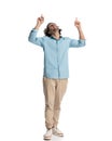 man pointing fingers in the air and looking up Royalty Free Stock Photo