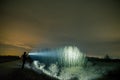 Man with flashlight in outdoor at night Royalty Free Stock Photo