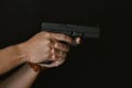 Man pointing gun ready to shoot, Killer with 9mm handgun pistol waiting for robbing the victim Royalty Free Stock Photo