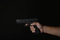 Man pointing gun ready to shoot, Killer with 9mm handgun pistol waiting for robbing the victim. Royalty Free Stock Photo