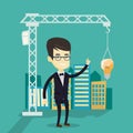 Man pointing at idea bulb hanging on crane. Royalty Free Stock Photo