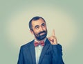 Man pointing with index finger and looking upwards Royalty Free Stock Photo