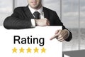 Man pointing on sign rating stars