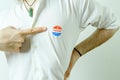 Man pointing to an I Voted Today sticker on his chest Royalty Free Stock Photo