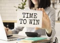 with a pen to the phrase TIME TO WIN on a white sheet Royalty Free Stock Photo