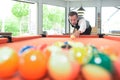 Man poised to break at pool table Royalty Free Stock Photo