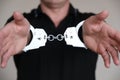 The man at the police station. Handcuffs on the wrists of the detained man Royalty Free Stock Photo