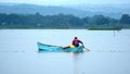 Man poling a boat in La Segua Wetland