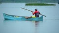 Man poling a boat in La Segua Wetland