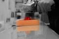 Man polishing a metal panel with an electric buffer Royalty Free Stock Photo