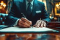 man politician businessman in suit signs a document contract agreement with pen in hand at table