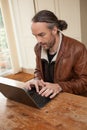 A man typing on his laptop