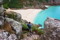 Man in Porthcurno beach view