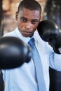 Man, portrait and boxing gloves in suit competition for manager job, ready for business or corporate confidence. Black Royalty Free Stock Photo