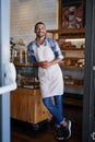 Man, portrait and confident owner in coffee shop, small business and ready for customer service. Male person, welcome Royalty Free Stock Photo