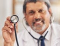 Man, portrait and a doctor with a stethoscope for healthcare, consultation or medical test. Happy, hospital and a mature Royalty Free Stock Photo