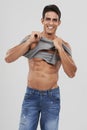 Man, portrait and dressing or bodybuilder pride in studio, happy and fitness by white background. Male person, abs and Royalty Free Stock Photo