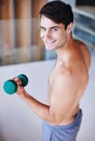 Man, portrait and dumbbell for weightlifting, fitness and muscle training for body and self care. Topless athlete Royalty Free Stock Photo