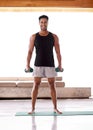 Man, portrait and dumbbell workout or weightlifting routine in home or healthy training, athlete or exercise. Male