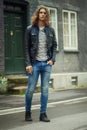 Man, portrait and fashion, streetwear and clothes with hair and pose in street or city in denim. Urban, young and gen z Royalty Free Stock Photo
