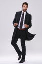 Man, portrait and fashion with suit in studio with confidence, elegant style and black tie aesthetic. Suave model Royalty Free Stock Photo