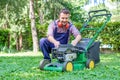 Man portrait mowing the lawn with lawnmower Royalty Free Stock Photo