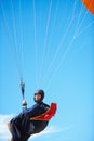 Man, portrait and paragliding in blue sky parachute for adventure fun, clouds or explore city. Male person, face and