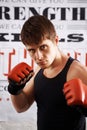 Man, portrait and professional fighter with boxing gloves in martial arts or MMA sports for self defense in dojo Royalty Free Stock Photo
