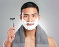 Man, portrait and razor or beard with shaving cream on white background, grooming or hair removal. Male person, face and Royalty Free Stock Photo