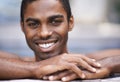 Man, portrait and relax poolside, happy and swimming on weekend for having fun on summer holiday. Black male person Royalty Free Stock Photo