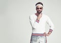Man, portrait and retro tennis fashion in studio for vintage style with 80s look, workout and sports gear. Sunglasses Royalty Free Stock Photo